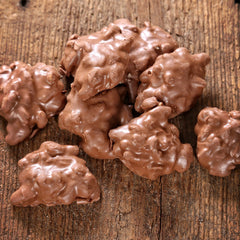 Mascot Pecan Clusters in a 1.25-pound tub, easy to share at gatherings.