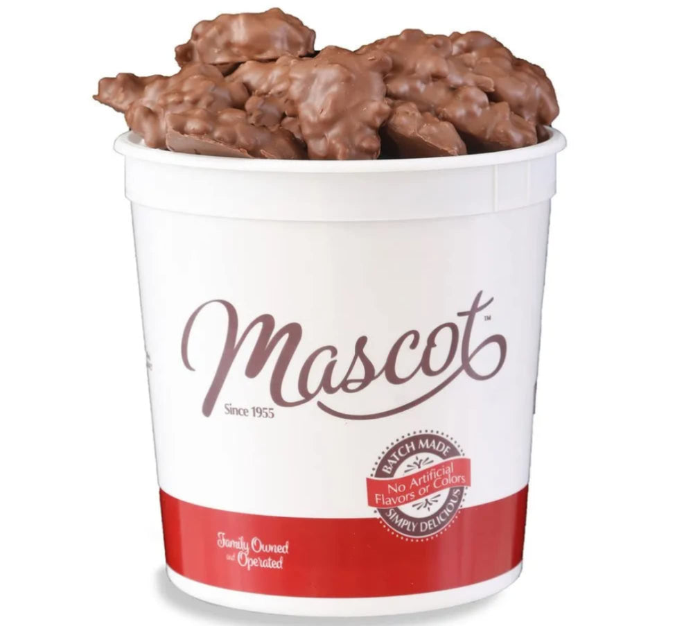 Mascot Pecan Clusters with smooth milk chocolate in a gift box, ideal for sharing.