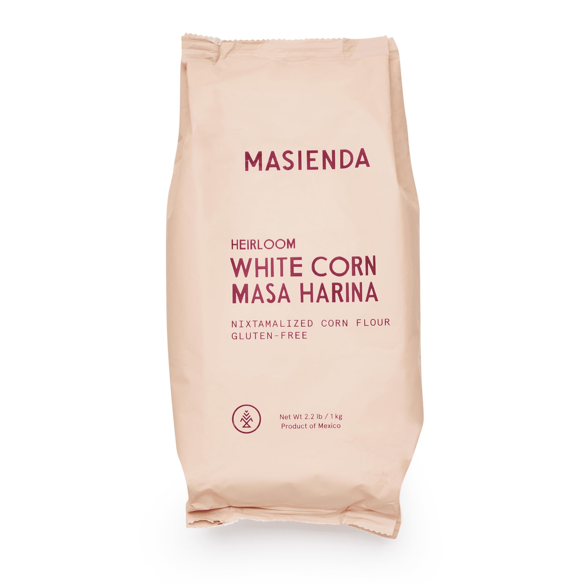 Masienda Heirloom White Corn Masa Harina bag shown on a wooden surface for authentic tortillas and tamales.
