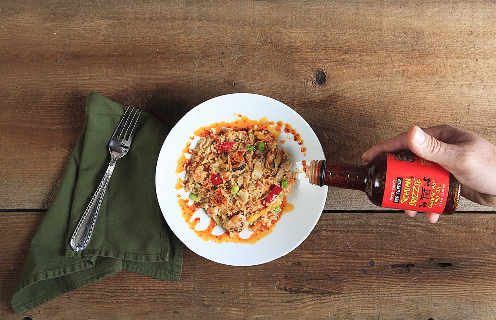 Steaming noodles topped with Master Chen's Drizzle for a quick, flavorful finish.