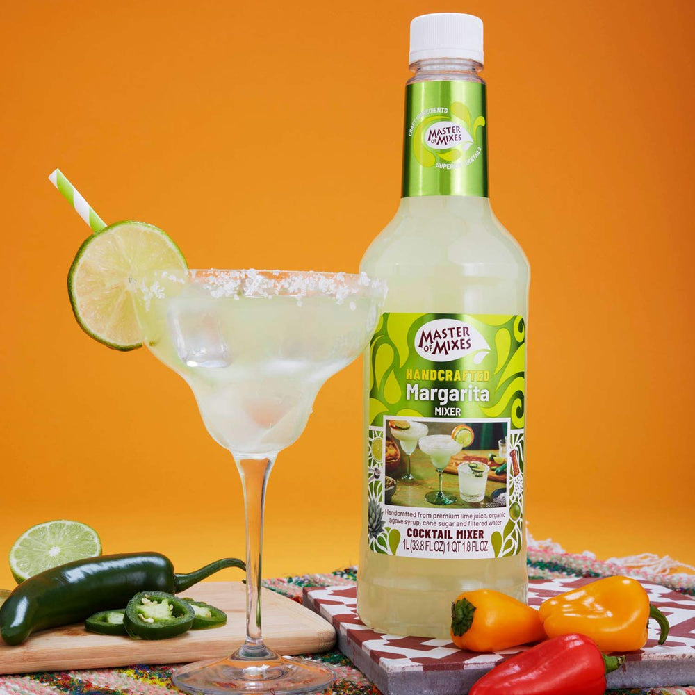Master of Mixes blood orange mix bottle showcasing vibrant color for cocktails