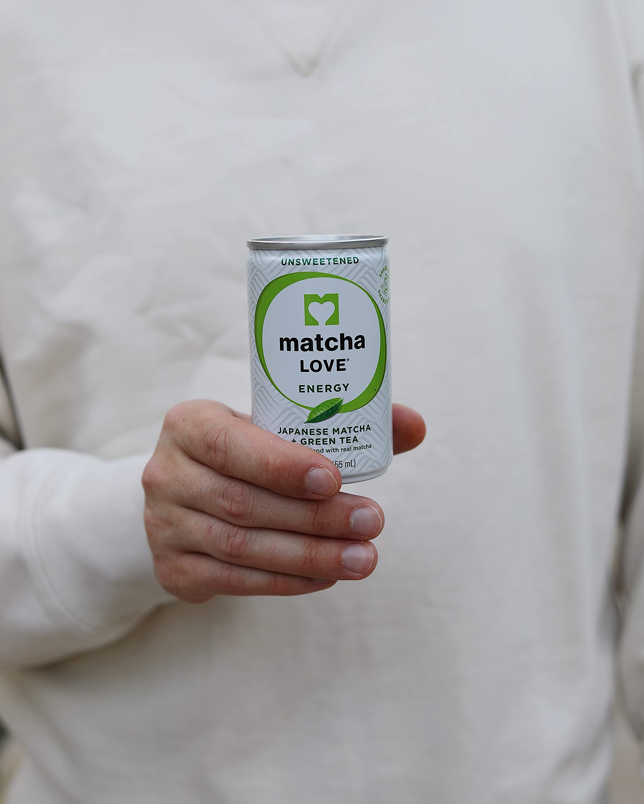 Matcha LOVE energy shot being poured into a glass for quick refreshment.
