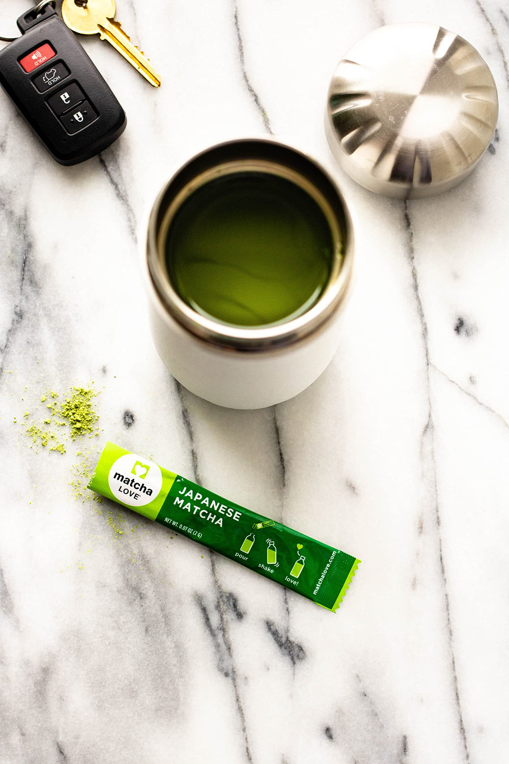 A warm cup of Matcha LOVE hot tea with a rich aroma.