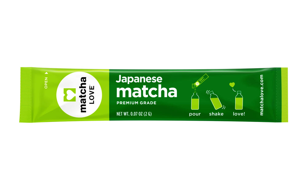 Open Matcha LOVE packet showing vibrant green powder ready to whisk.