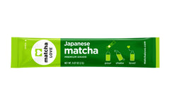 Open Matcha LOVE packet showing vibrant green powder ready to whisk.