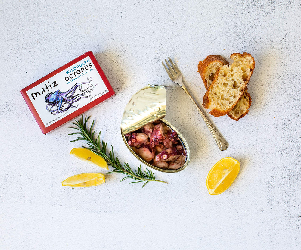 Matiz Pulpo serving idea with lemon and paprika for a quick appetizer.