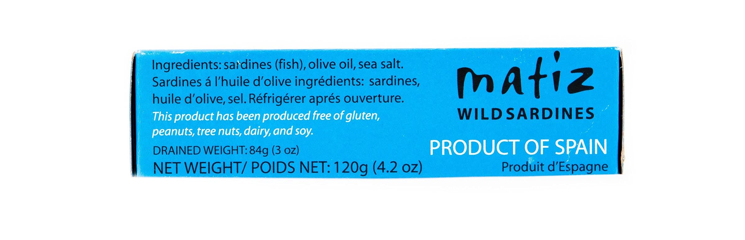 Matiz sardines in olive oil on tapas plate with olives and herbs