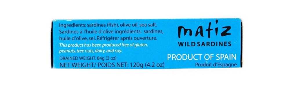 Matiz sardines in olive oil on tapas plate with olives and herbs