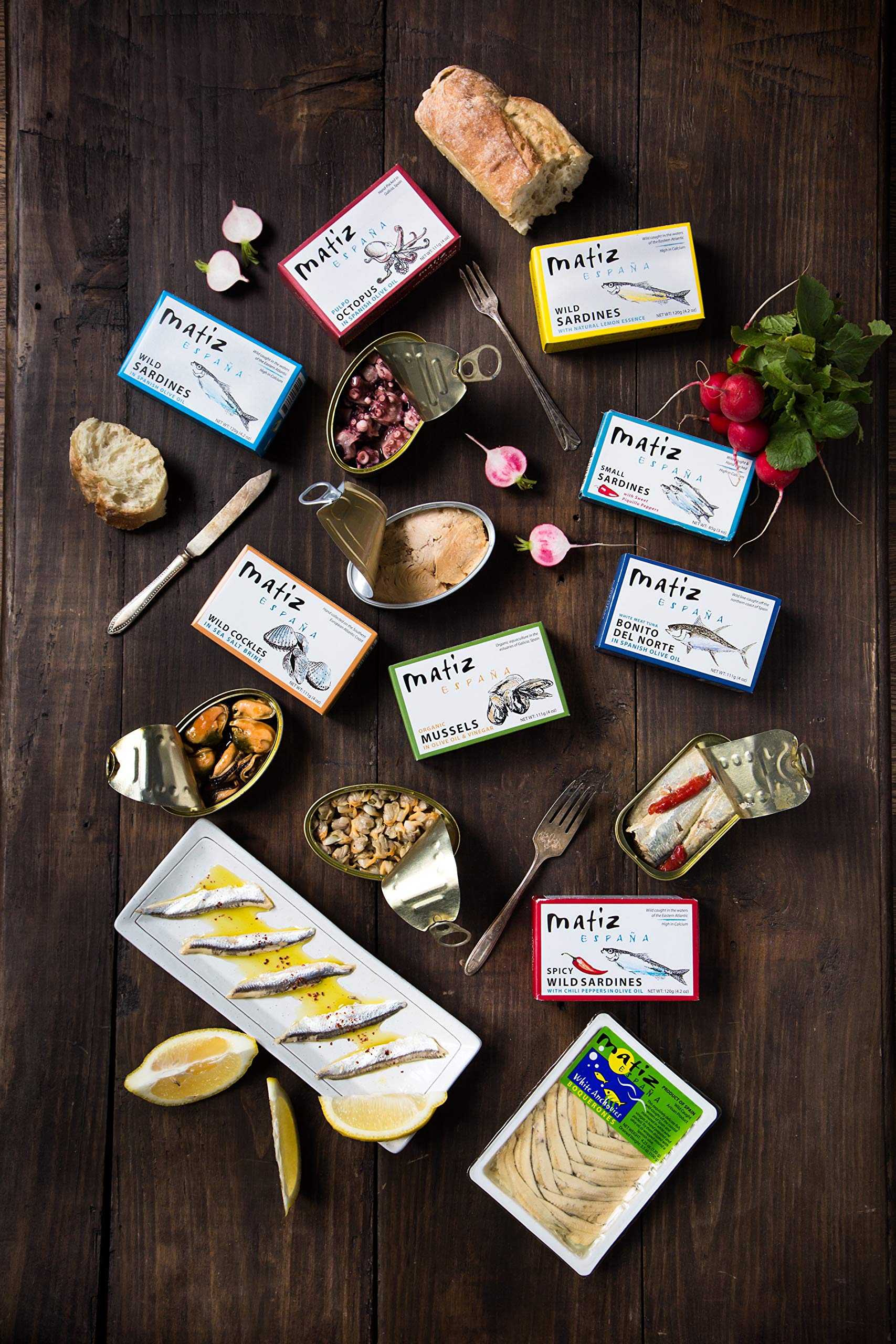 Matiz Sardines Lightly Smoked serving suggestion with lemon - bright flavor lift in dishes.