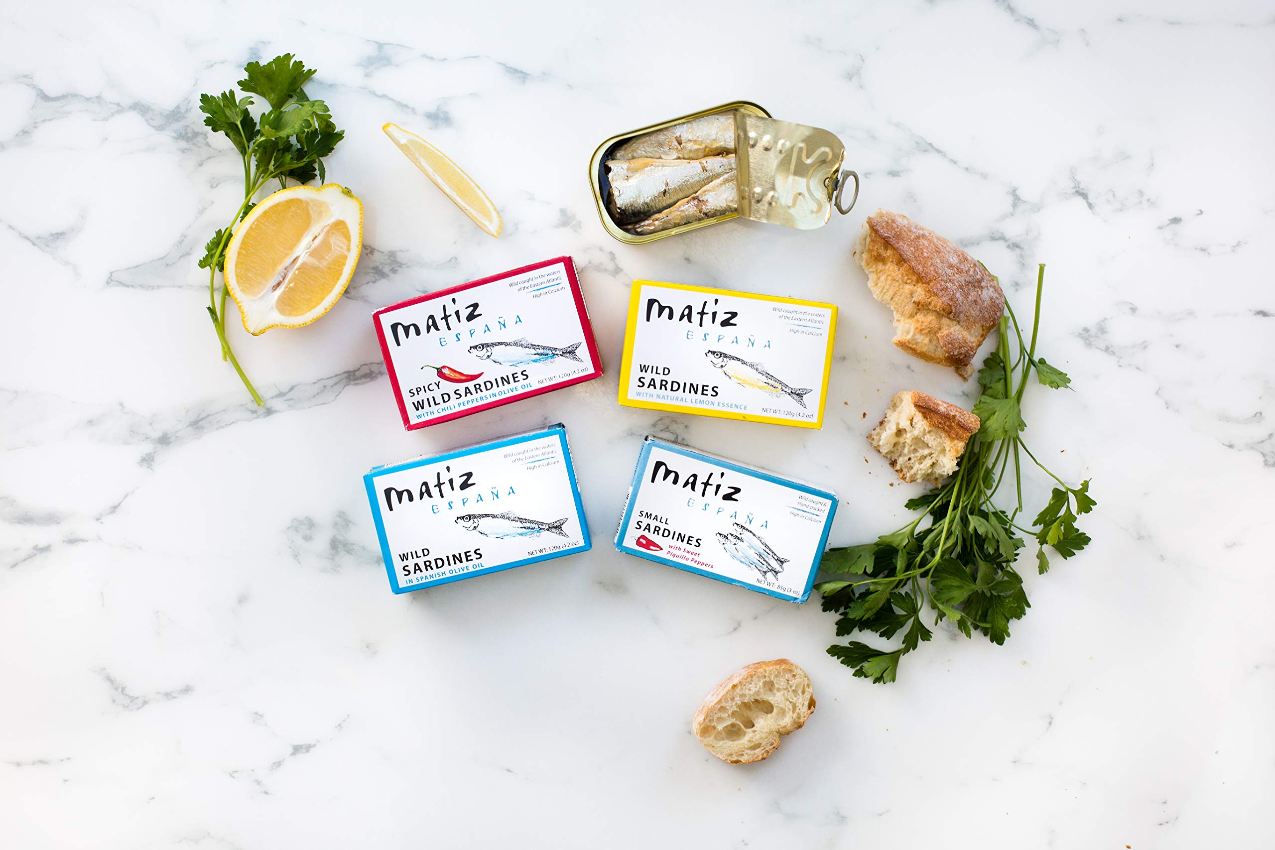 Matiz Sardines in olive oil tin close-up, premium ingredients shine.