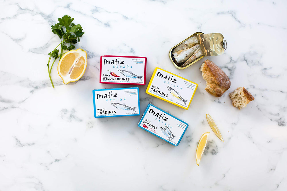 Matiz sardines on a plate showcasing plump texture and color.
