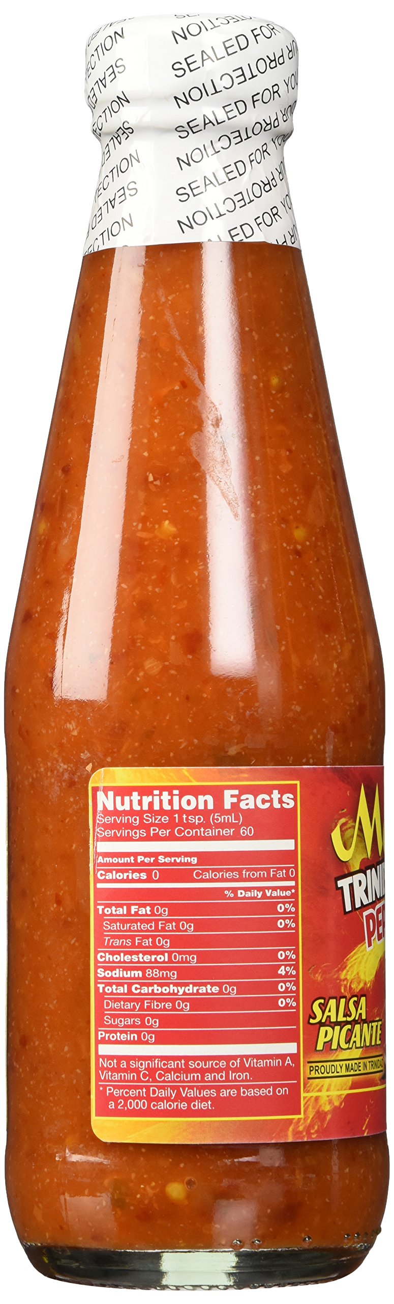 Matouk's Trinidad Scorpion sauce being poured for a fiery kick.
