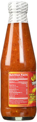 Matouk's Trinidad Scorpion sauce being poured for a fiery kick.