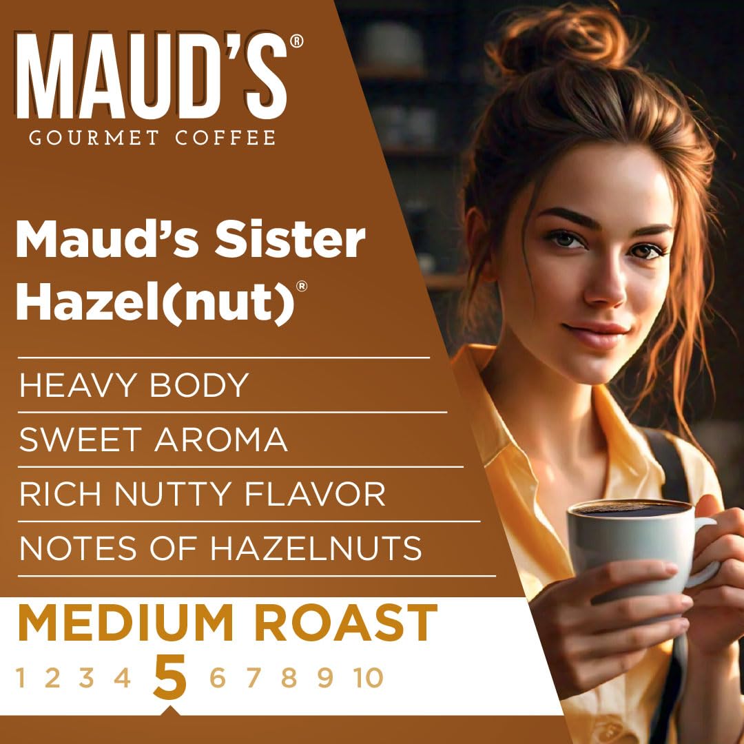 MAUD'S 100% Arabica beans visible in a scoop, signaling quality.