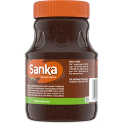 Steaming cup of Maxwell House Sanka decaf instant coffee for a quick brew.