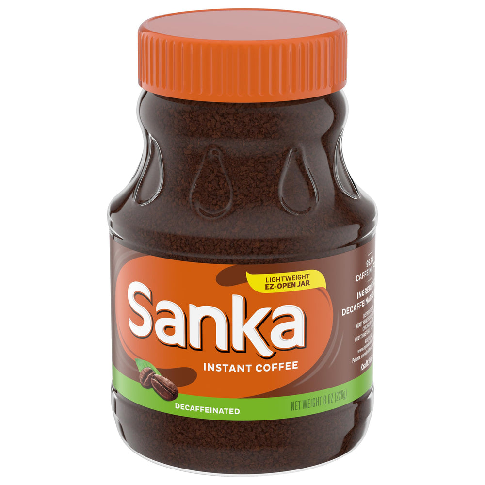 Stirring Sanka decaf into hot water for a quick cup.
