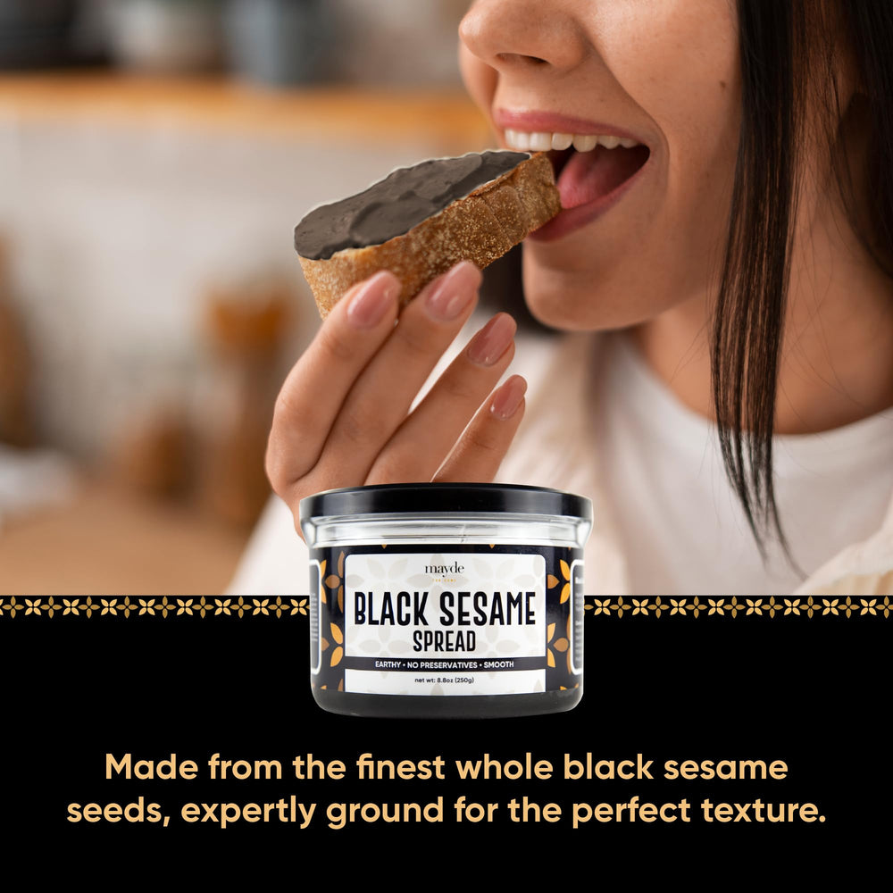 Mayde black sesame paste spread on a slice of bread shows texture.