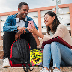 Maynards Bassetts Cherry Blasters bag pouring candies into a bowl.