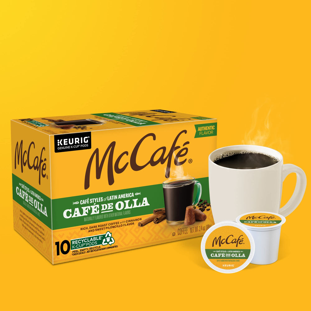 Steam rises from a McCafé Café de Olla cup with rich hue.