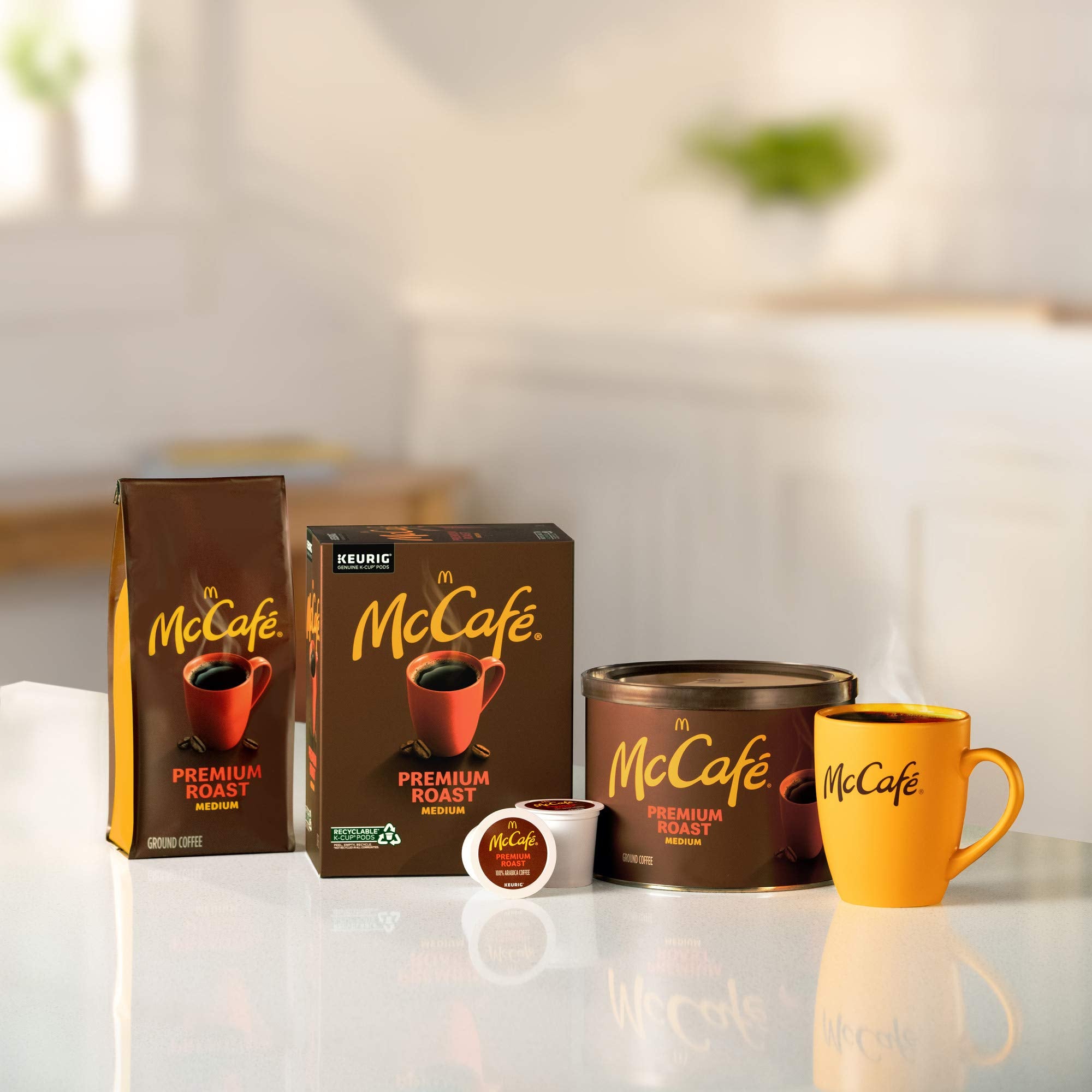 Ground McCafé Premium Roast grounds pour into a coffee filter
