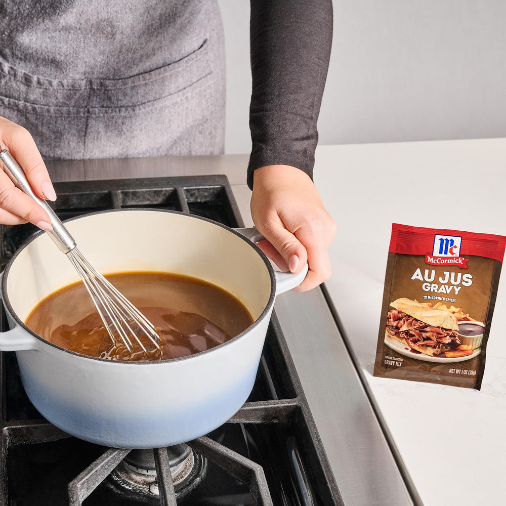 French dip sandwich dunked in warm McCormick Au Jus Gravy.
