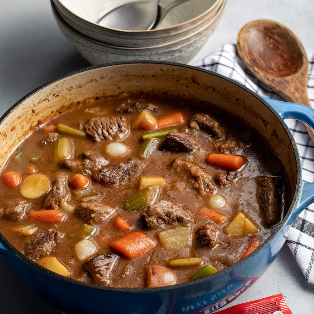 Simmering beef stew in a pot using McCormick seasoning