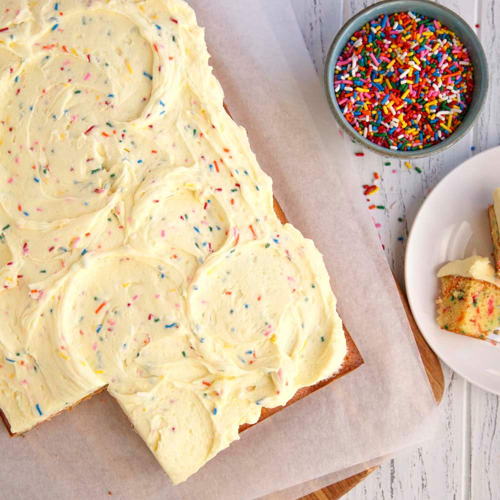 McCormick Cake Batter Flavor mixing into frosting to deepen cake taste.