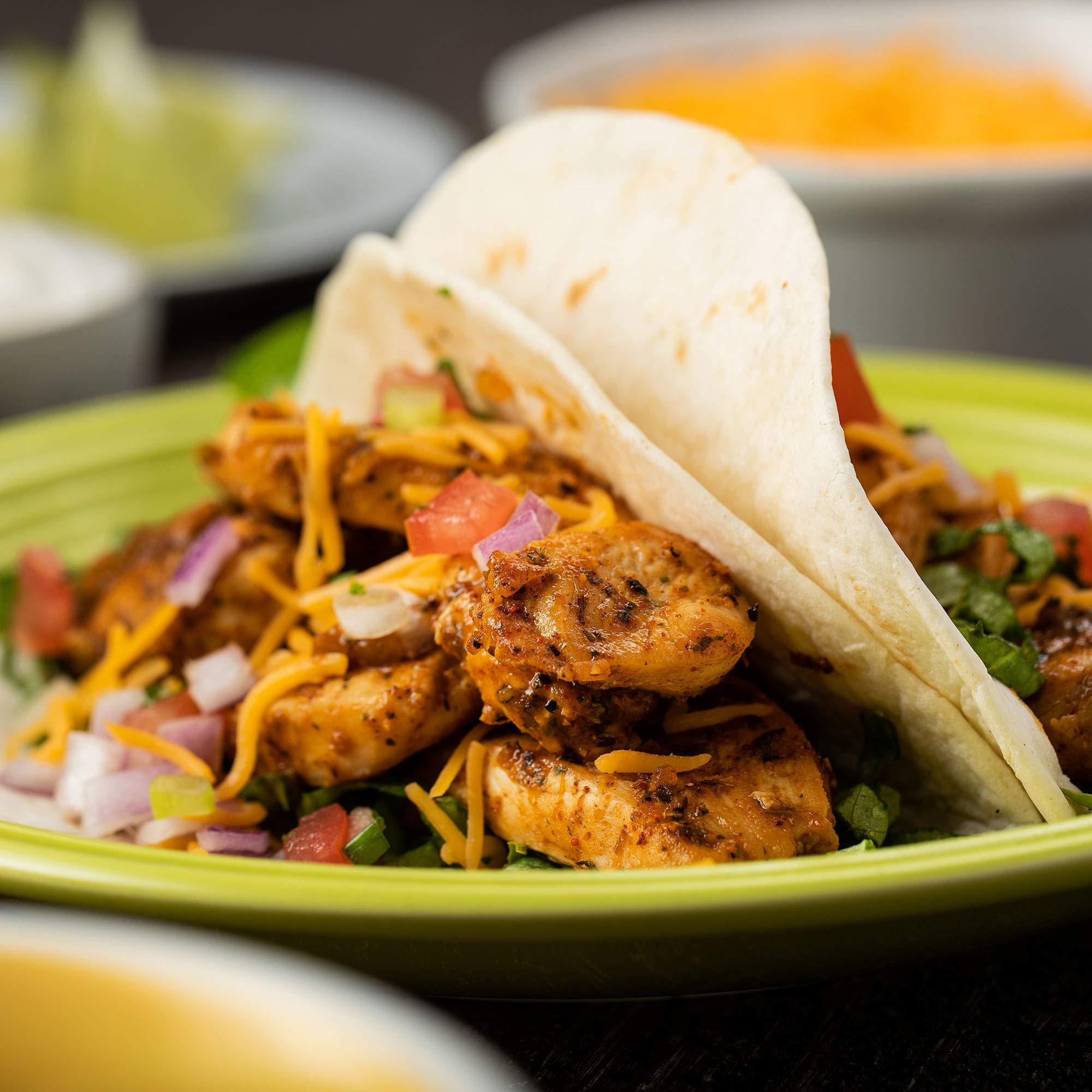 Ingredients in a bowl with McCormick Chicken Taco Seasoning Mix ready to mix.