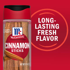 A saucepan with McCormick Cinnamon Sticks releasing spice while simmering.