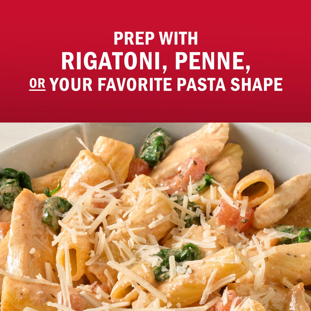 Kitchen scene with spices and pasta and McCormick Creamy Tuscan aroma.