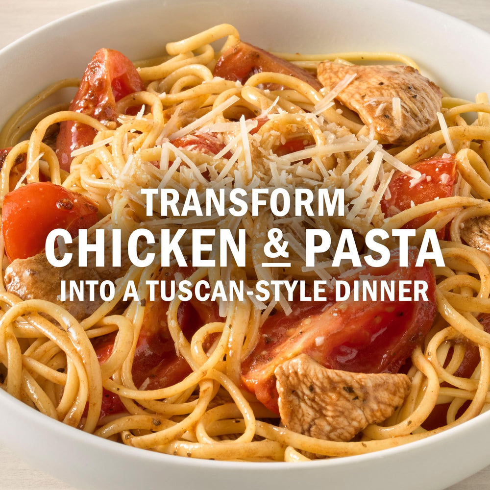 Parmesan cheese finishing the Creamy Tuscan Chicken & Pasta dish.