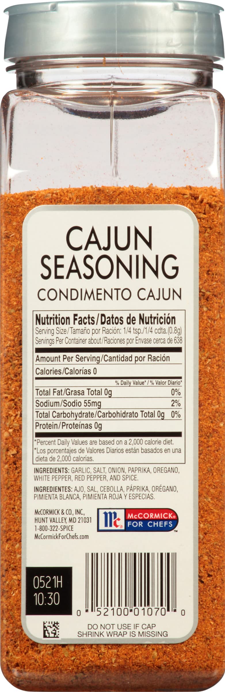 Pouring McCormick Culinary Cajun Seasoning to add bold flavor quickly.