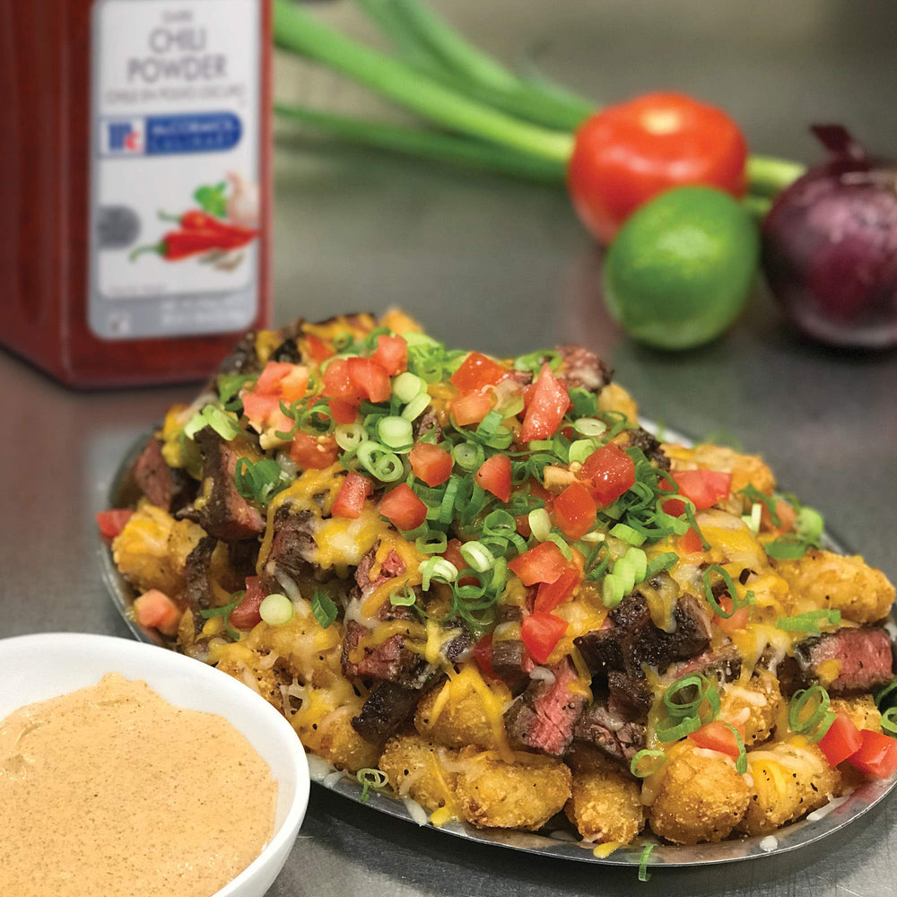 McCormick Culinary Dark Chili Powder adds color to enchiladas