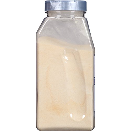 McCormick Culinary Garlic Powder canister beside cooked pasta, highlighting quick garlic flavor.