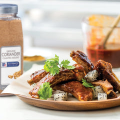 Kitchen shelf shot featuring McCormick Culinary Ground Coriander among spices
