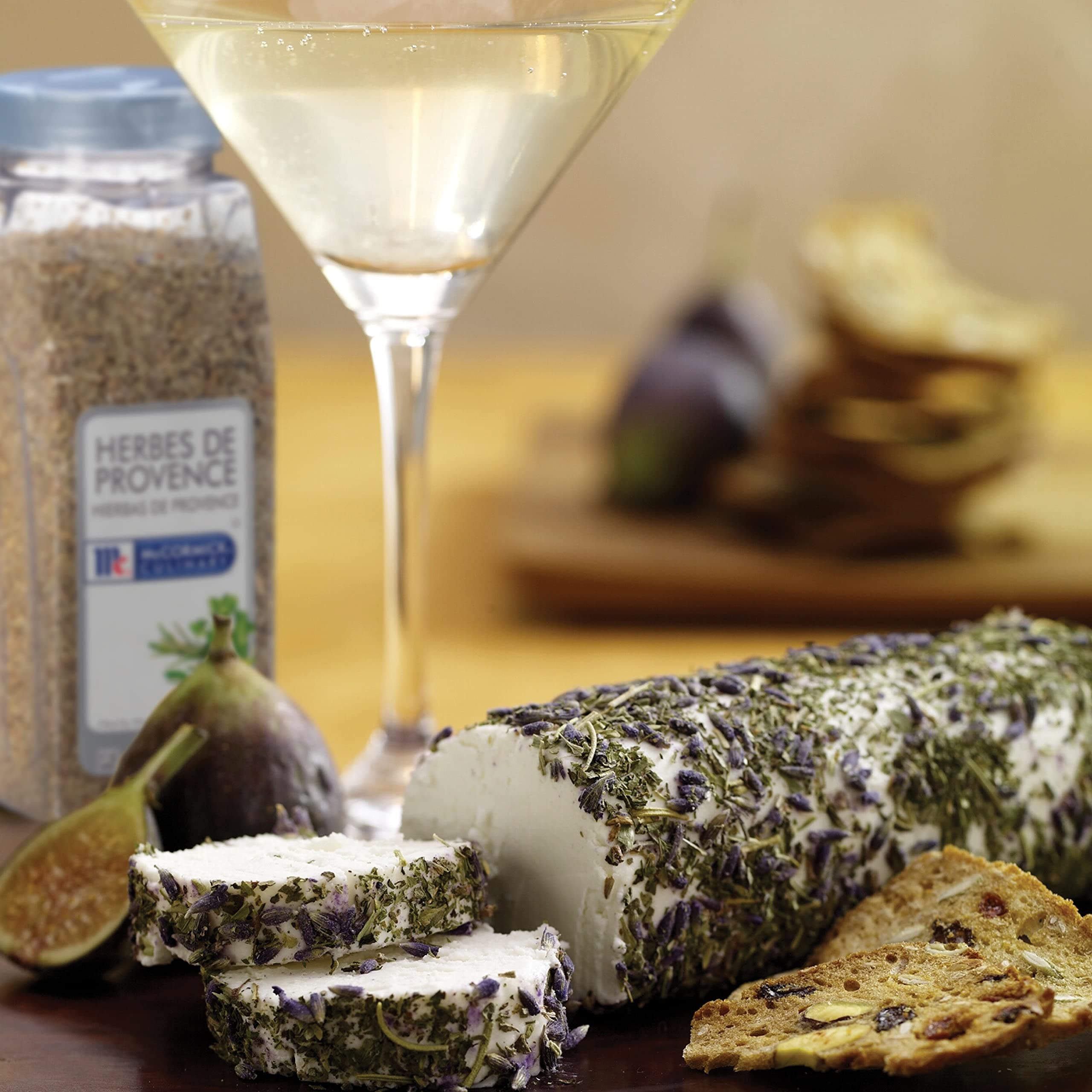 McCormick Culinary Herbes de Provence sprinkled over couscous for fragrant Mediterranean flavor.