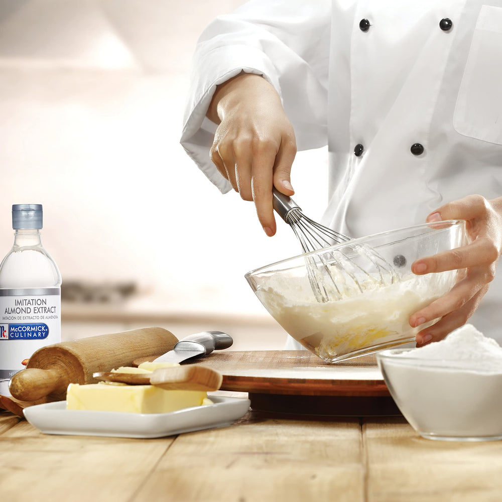 McCormick Culinary imitation almond extract in baking setup for cookies and cakes.
