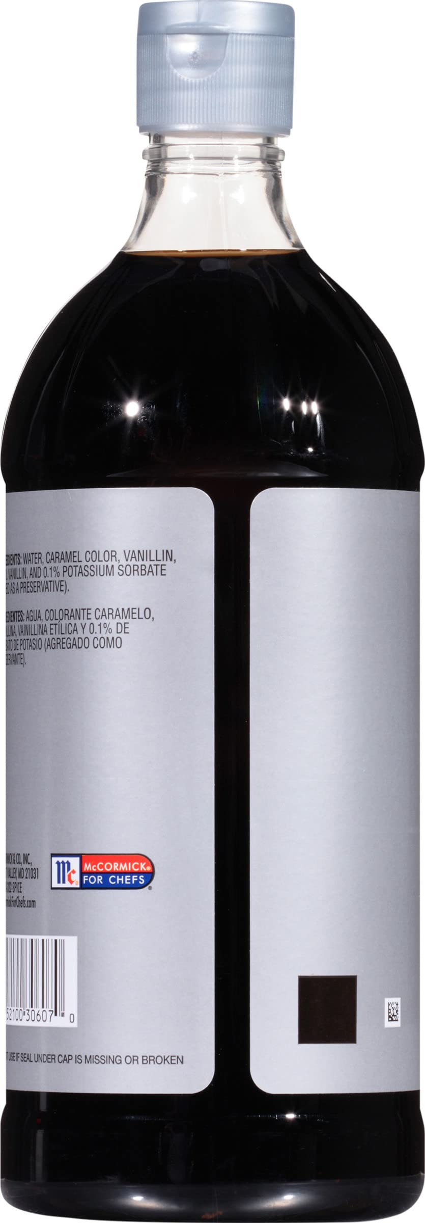 Pouring McCormick Culinary Imitation Vanilla Flavor for desserts