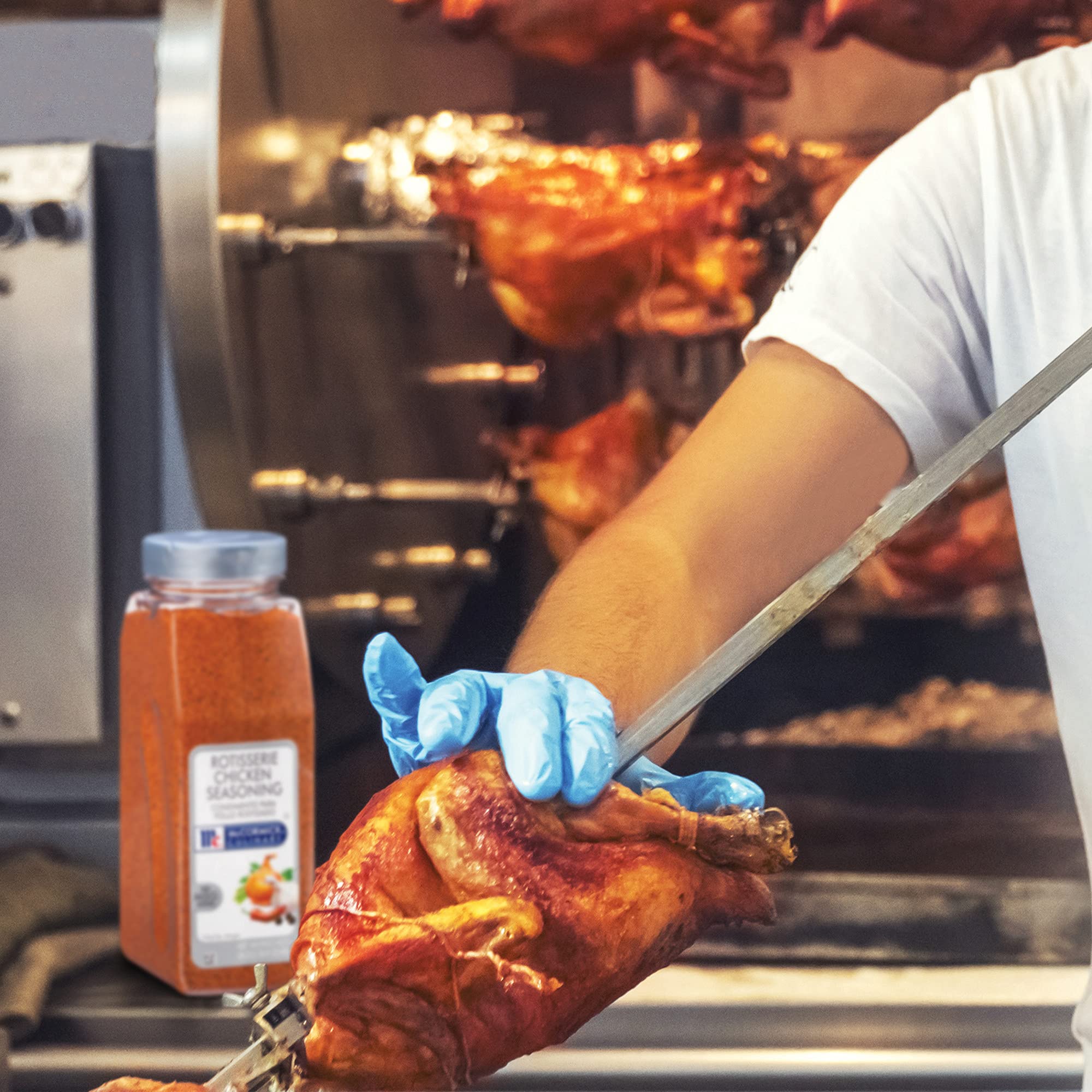 Rotisserie chicken on a rack with McCormick Seasoning demonstrating versatile use
