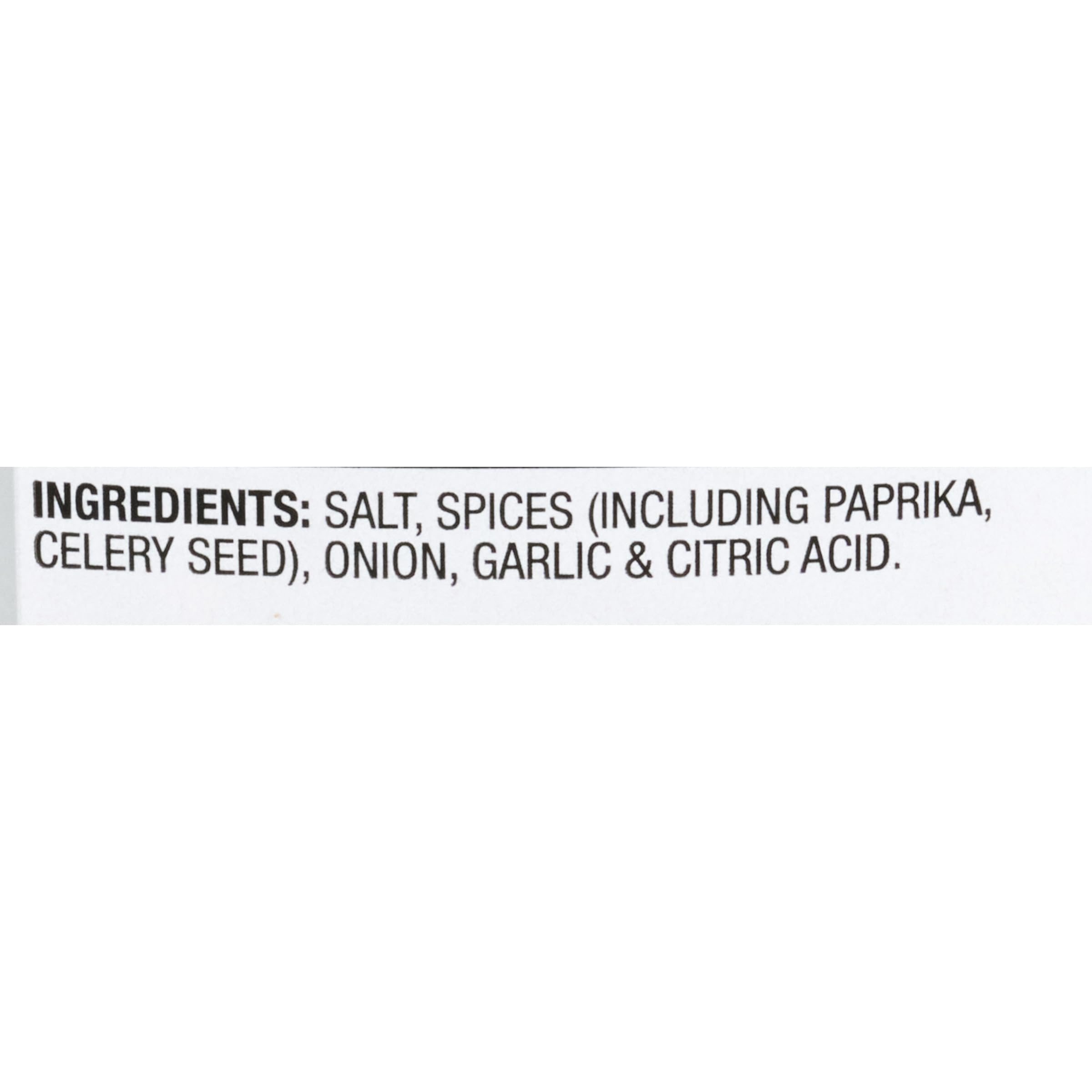 Pouring McCormick Rotisserie Chicken Seasoning over poultry for even, savory flavor