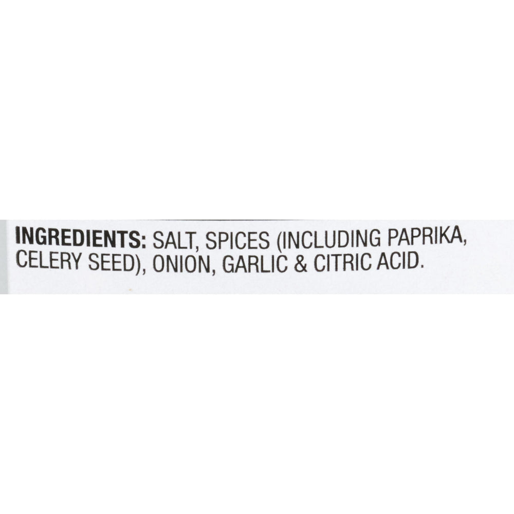 Pouring McCormick Rotisserie Chicken Seasoning over poultry for even, savory flavor