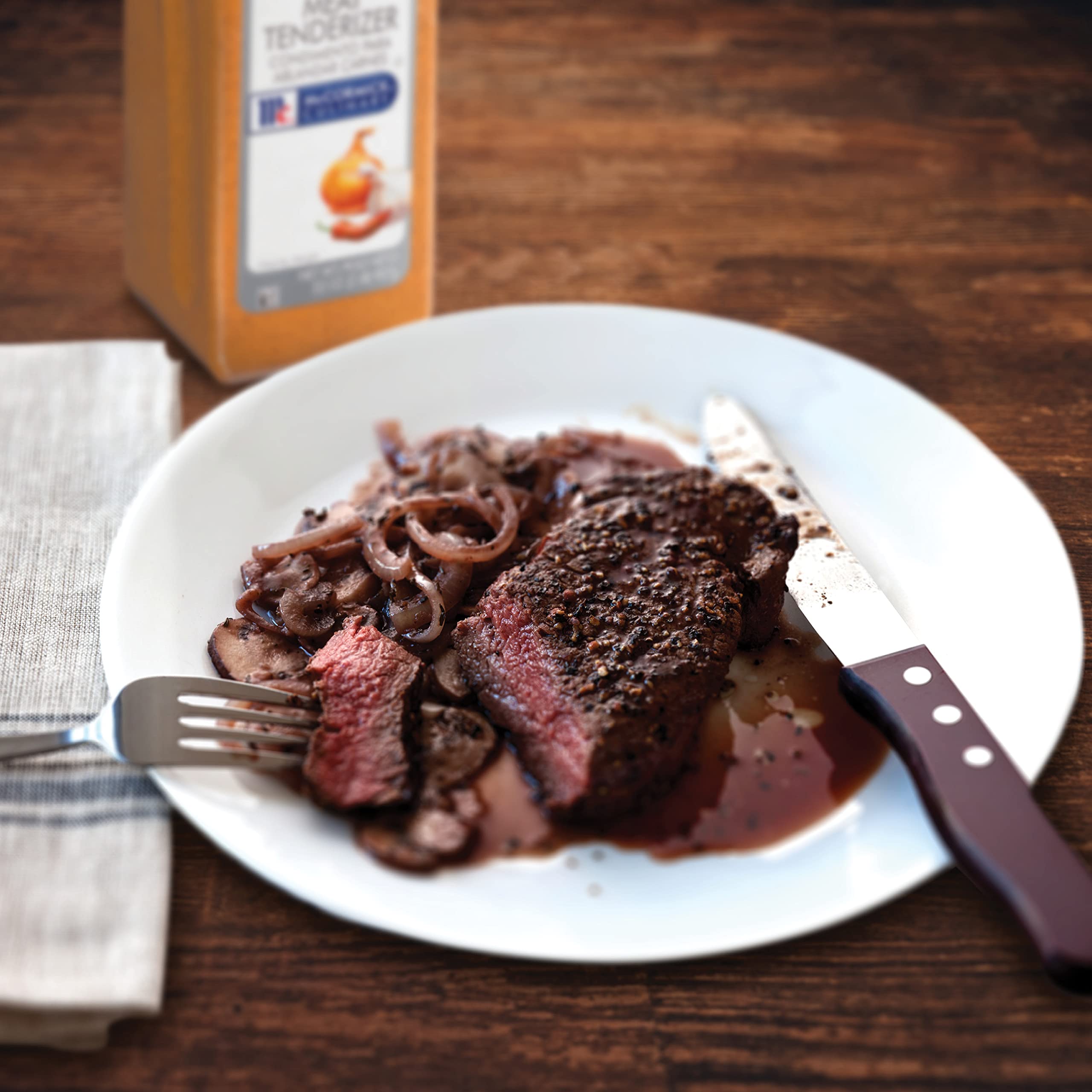 Seasoned beef and poultry on grill after McCormick Culinary tenderizer application