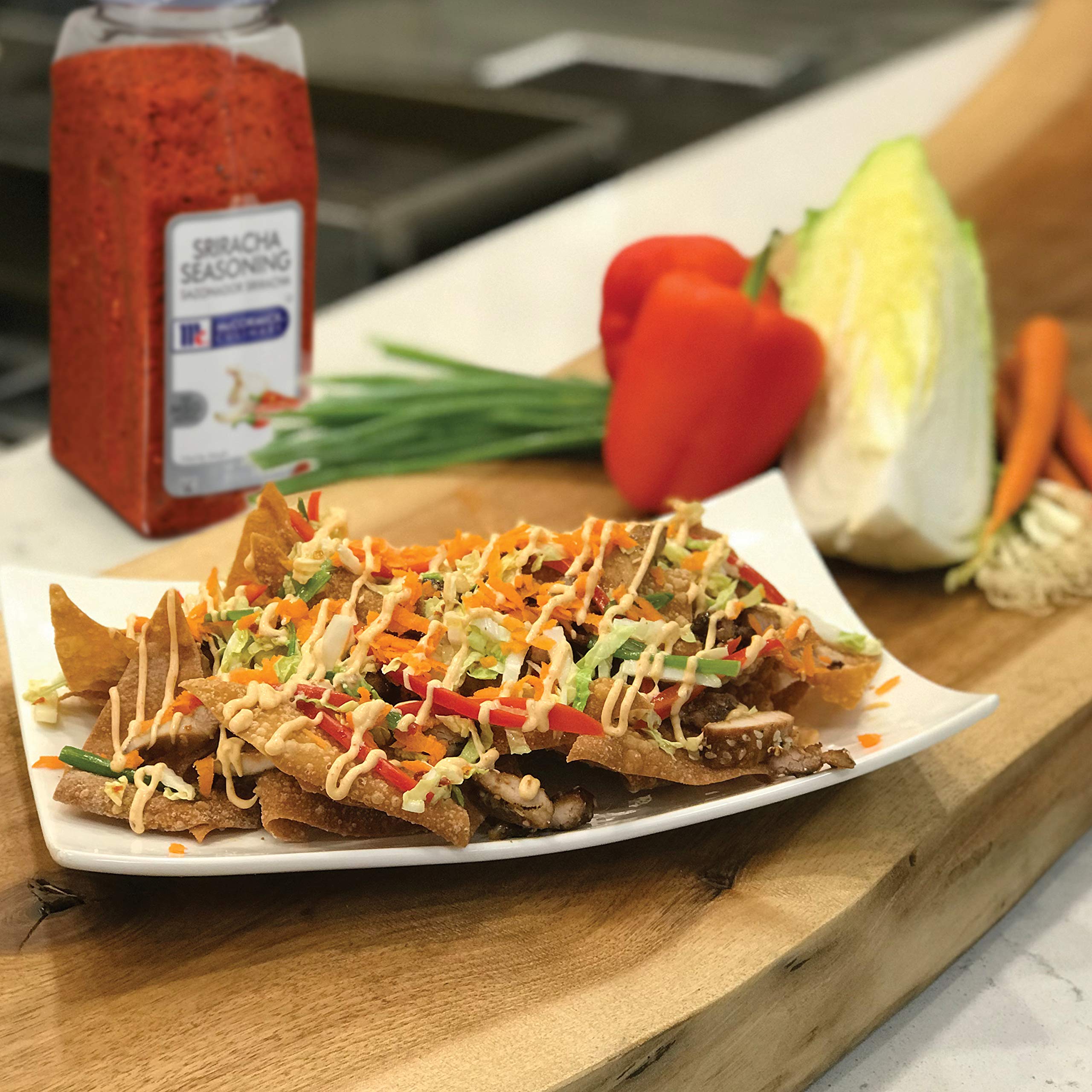 McCormick Culinary Sriracha Seasoning container on a kitchen counter ready for batch cooking.