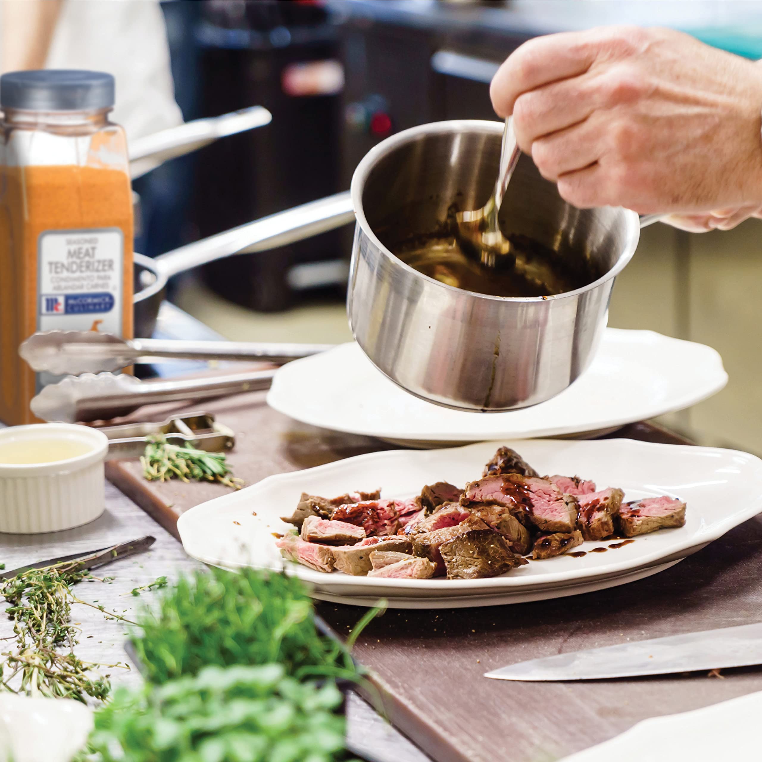Applying McCormick Culinary tenderizer to meat before cooking demonstrates prep in action