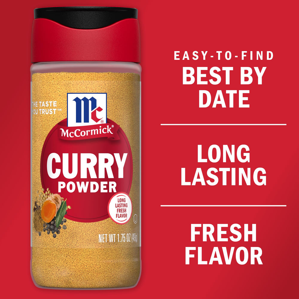 McCormick curry powder dusting over roasted vegetables for warmth.