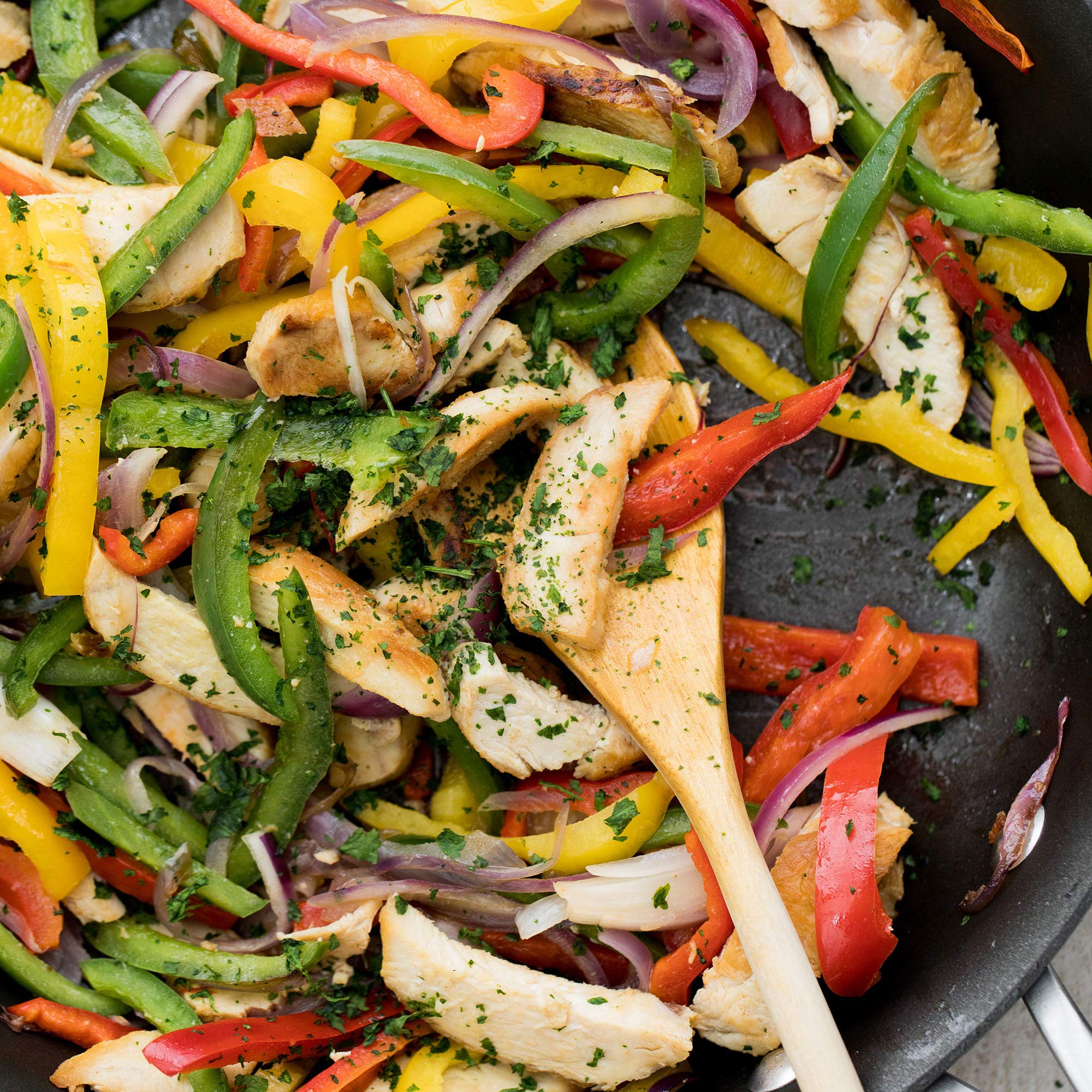 McCormick fajita seasoning mix plated fajitas with peppers and onions
