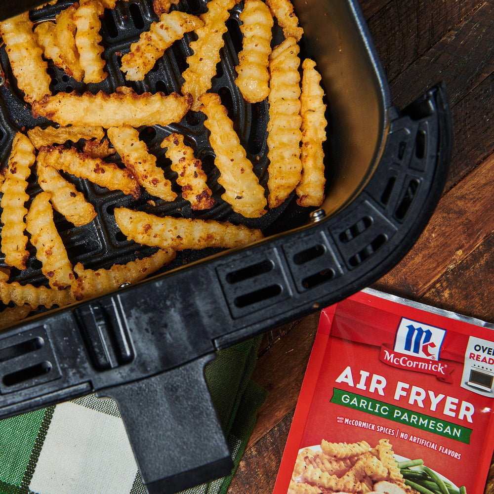 McCormick Garlic Parmesan Seasoning with herbs close-up shows oregano and basil notes