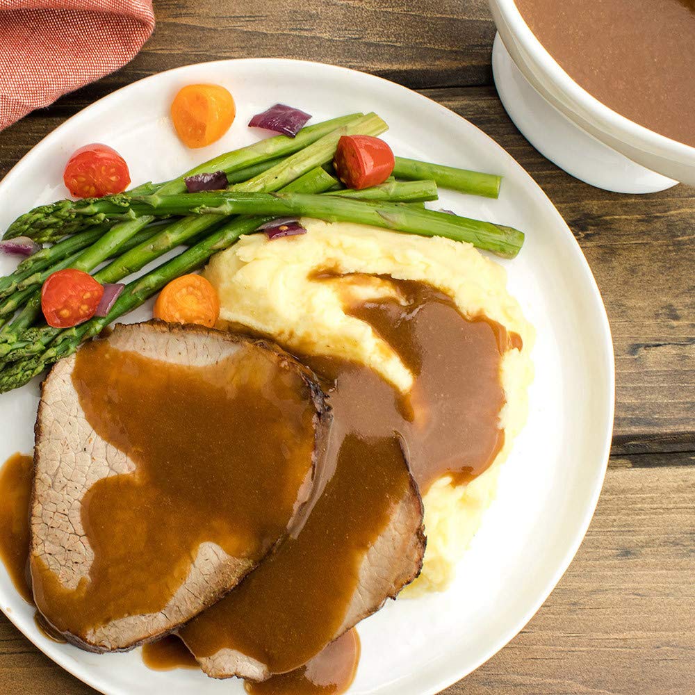 McCormick gluten-free brown gravy poured over mashed potatoes for serving