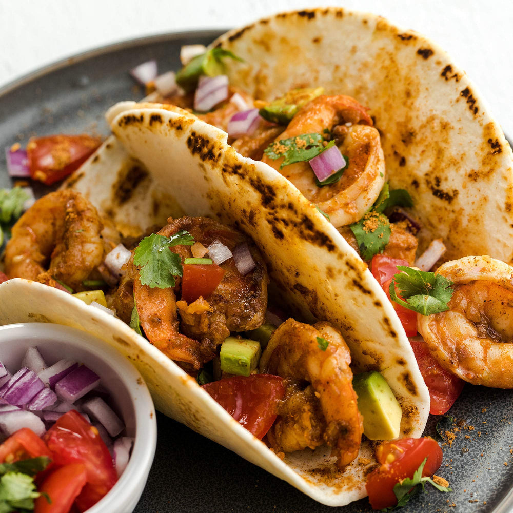 Shaker dispenses McCormick Gluten Free Taco Seasoning Mix for even dusting