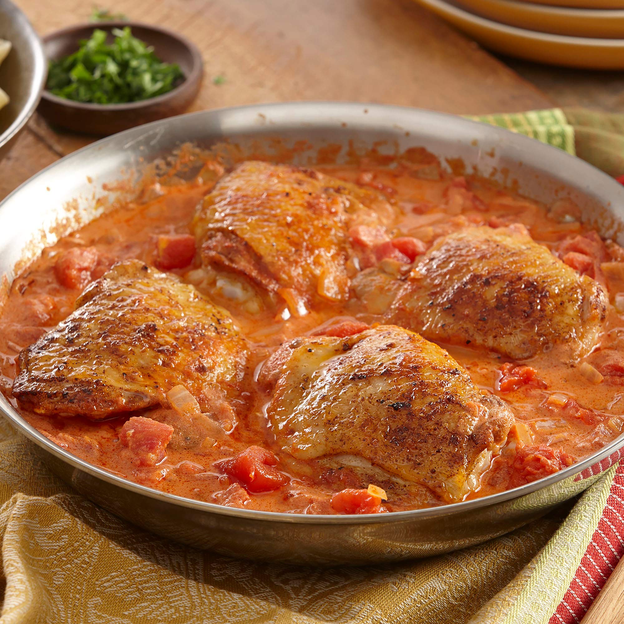 McCormick Gourmet Hot Hungarian Paprika color glow over a simmering dish